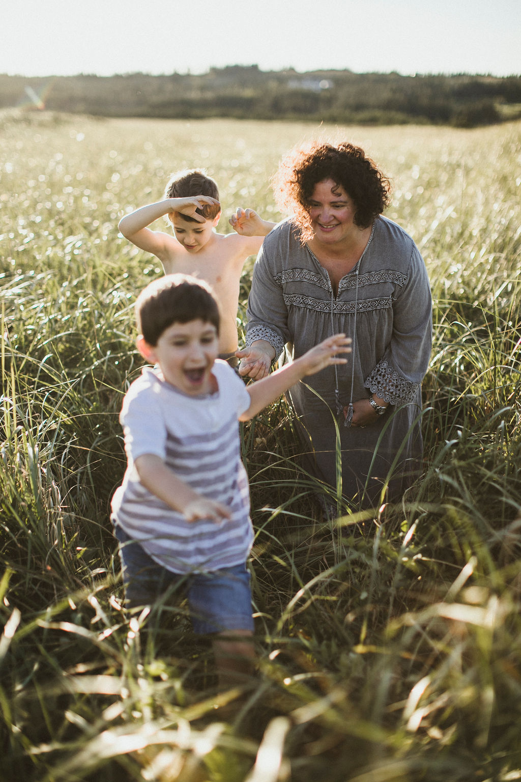 Lisa in a field with children